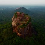 Sigiriya rock fortress rises above lush Sri Lankan jungle